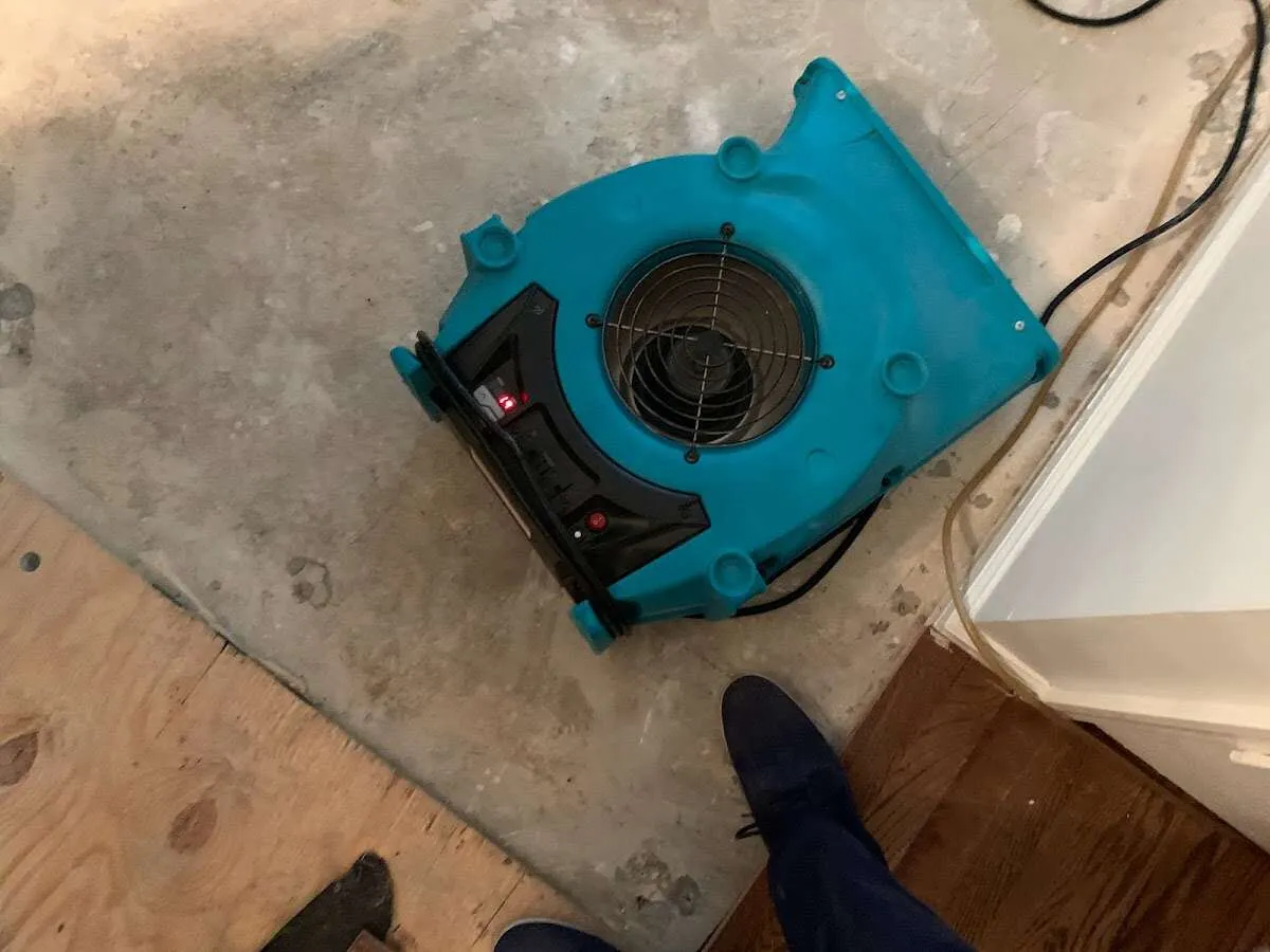 Air mover drying subfloor during Leak Detection & Repair in McKeesport